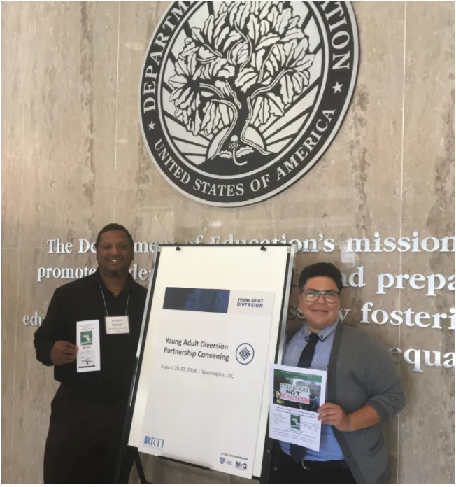 Laney College’s Vincent Garrett and Alejandra Landin pose under the seal of the Department of Education seal after receiving technical support for their goal to help students with the Alameda County Clean Slate Program. (Photo: Vincent Garrett/Restoring Our Communities)