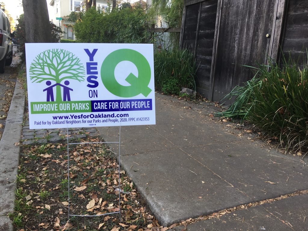 A sign supports Measure Q along the sidewalk in the Rockridge neighborhood of Oakland