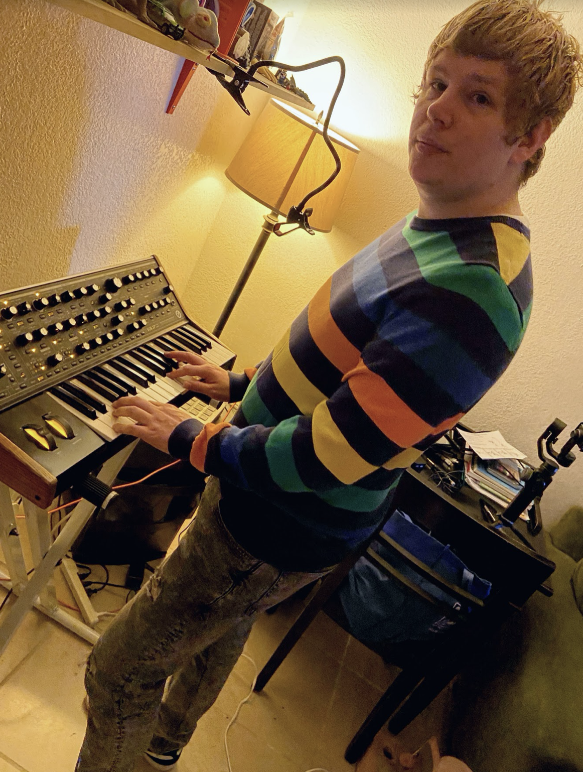 Michael Jones plays the piano at home while sheltering in place on March 26, 2020. (Photo courtesy of Michael Jones)