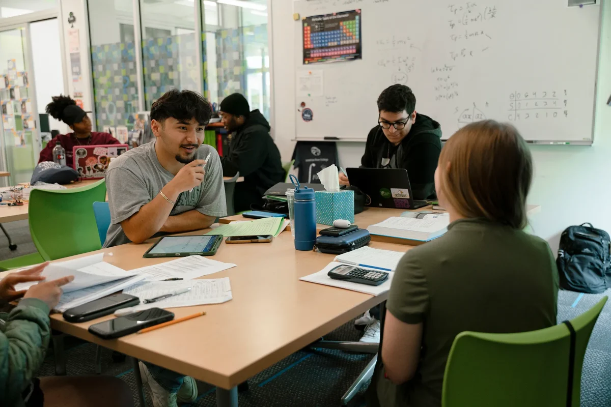 Students discuss their work in class at the MESA center at American River College on April 25, 2024. (Photo: Cristian Gonzalez/CalMatters)
