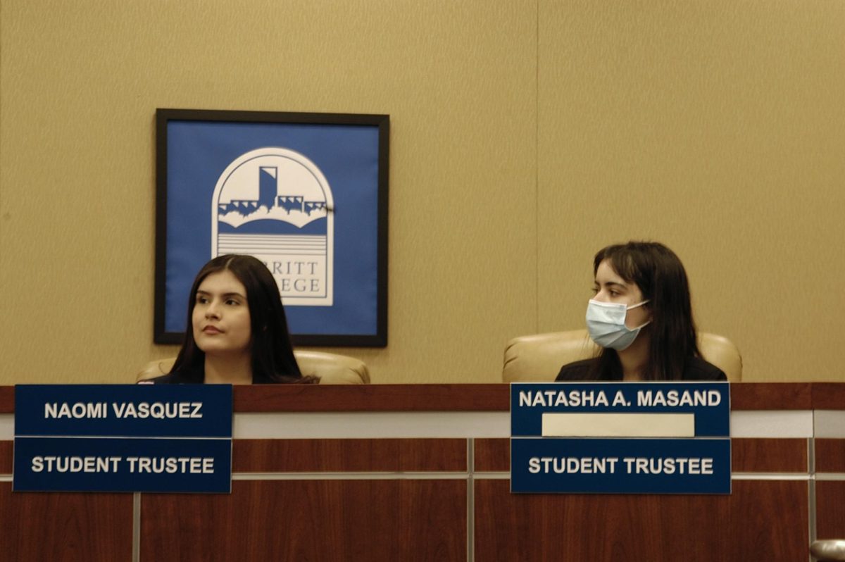 Vasquez and Masand at a Feb. 27 trustee meeting. 