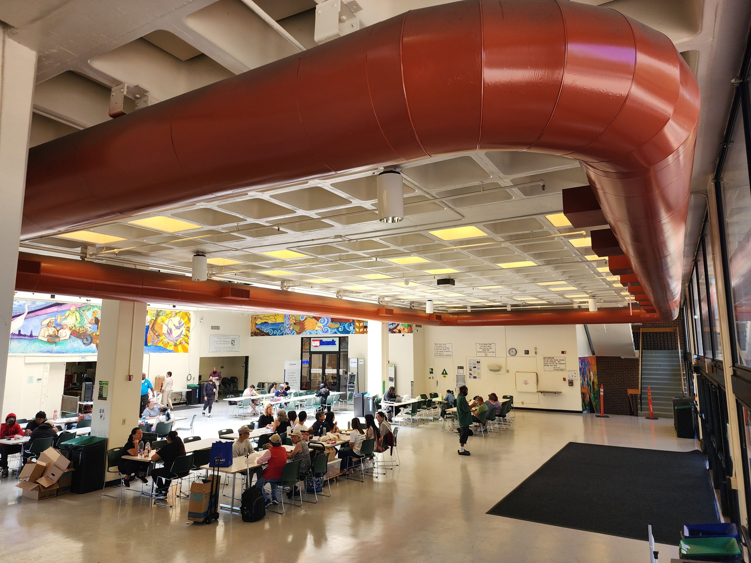 The newly reopened Laney Cafeteria, packed with students, faculty, and staff, now offers burgers, salads, sandwiches and more. 