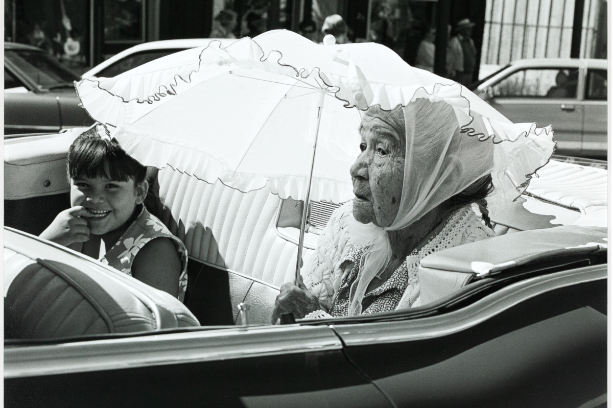 Native American photographer Dugan Aguilar spent decades documenting the lives of Indigenous Californians through his camera lens. His collection of work is on display now at the Oakland Museum of Califoria. (Shown: “Mimi Mullen (Madiu) Grand Marshall,” 1997 Greenville Gold Digger Days Parade)