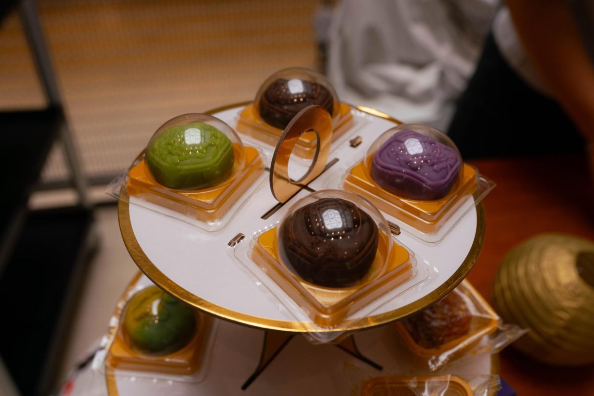 Mooncakes in a variety of colors and flavors sit in a display at Berkeley City College on Oct. 8, 2025. API LEAD students traded mooncakes for trivia to celebrate the Mid-Autumn Festival with the BCC community